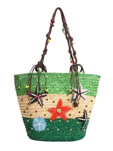 Bohemian style multi-color woven straw tote bag with flower charms and beaded straps