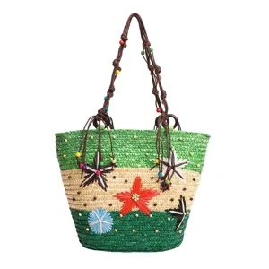 Large capacity handmade woven straw tote bag featuring colorful flower appliques