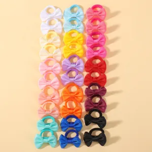 Details of colorful mini bow hair ties with soft grosgrain ribbon for cute kids and babies.
