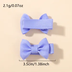 Detalle de la pinza para el pelo con lazo de cinta grosgrain violeta de 3,5 cm