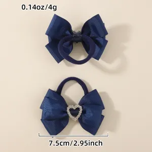 Detail view of navy blue hair tie with rhinestone heart bow, perfect for cute kids styling.