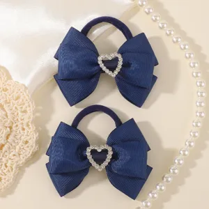 Kids navy blue rhinestone bow hair ties detailed with sparkly heart for cute daily hairstyles.