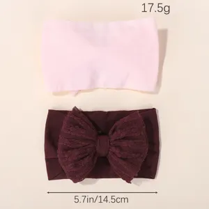 Stretchy baby headband set featuring a large lace bow and soft pink fabric texture