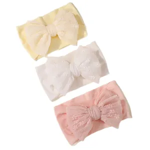 Set of three soft pleated lace bow headbands for baby girls in pastel colors