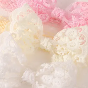 Sélection de bandeaux en dentelle pour bébé avec nœuds en rose blanc et crème doux