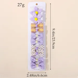 Lot de 10 pinces à cheveux colorées avec nœuds violets et fleurs pour enfants sur présentoir