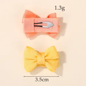 Detailed view of children's candy color bow hair clips showing 3.5cm size and 1.3g weight.
