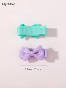 Detailed view of mini grosgrain bow hair clips showing 3.5cm width measurement