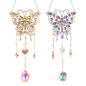 Detailed view of gold and silver butterfly suncatchers with heart 'I Love You Mom' charms