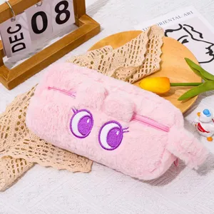 Cute pink plush pencil case detail, large capacity soft stationery storage bag with cartoon eyes.