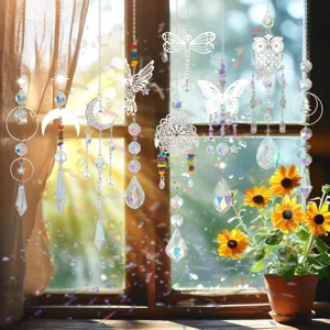 Decorative crystal suncatchers hanging by a sunny window with vibrant rainbow light effects