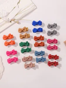 Close-up of colorful mini grosgrain ribbon bow hair clips set for little girls