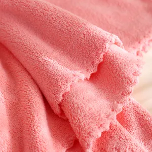 Soft coral fleece towel detail, thick absorbent quick dry pink bath towel for home daily use.