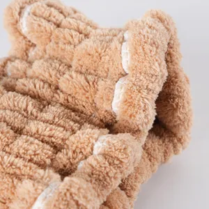 Detail shot showing soft brown coral fleece headband texture, perfect for daily skincare routine.