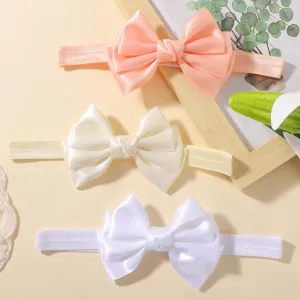 Lot de trois bandeaux pour bébé avec nœuds en satin rose, crème et blanc soyeux