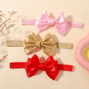 Lot de trois bandeaux élastiques pour bébé avec grands nœuds en satin rose, or et rouge