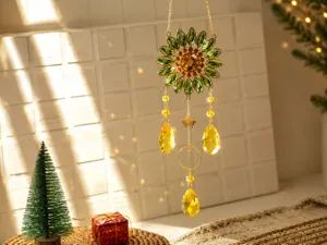 Crystal sunflower suncatcher hanging ornament reflecting rainbow prism light on a wall.