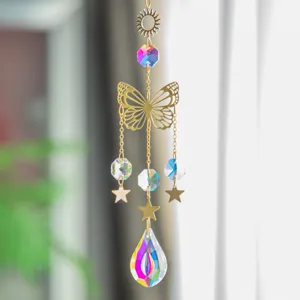 Detailed view of a golden butterfly suncatcher with iridescent rainbow crystals