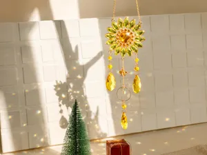 Crystal sunflower suncatcher pendant creating rainbow light refraction on white wall