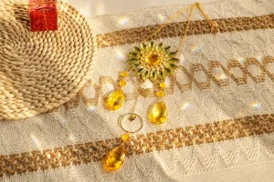 Detailed shot of yellow crystal sunflower light catcher with rainbow light refraction