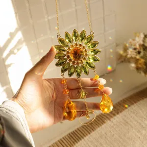Close-up of sunflower crystal suncatcher showing warm light refraction and bee charm