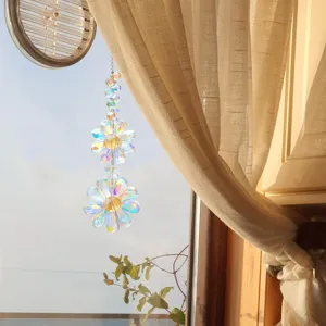 Macro detail of iridescent crystal flower suncatcher producing rainbow reflections by window