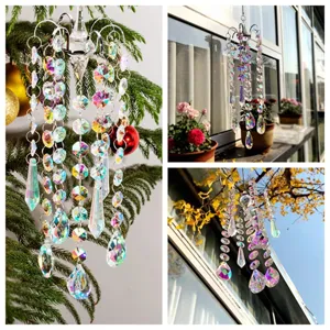 Detail view of crystal chandelier suncatcher hanging on a Christmas tree branch