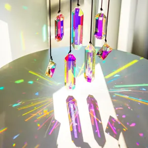 Close-up detail of 7 crystal sun catcher prisms casting vibrant rainbow light reflections.