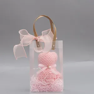 Bolsa de regalo de PVC transparente con osito de toalla rosa y lazo, ideal para bodas y eventos.