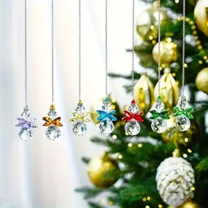 Variety of colorful faceted crystal suncatchers hanging from silver chains in a festive setting
