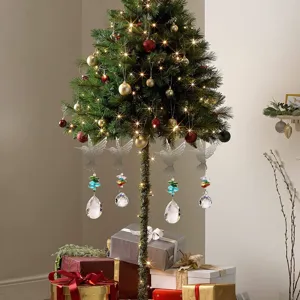 Exquisite hummingbird crystal suncatchers with colorful prisms on Christmas tree.