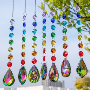 Close-up view of 7 vibrant crystal suncatchers featuring diverse rainbow pendant shapes.