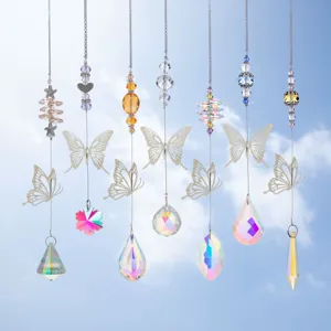 Detailed view of crystal suncatchers with metal butterflies against a clear sky