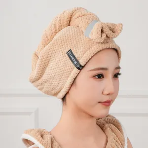 Microfiber quick-dry hair drying towel cap detail showing soft fabric and cute bow design.