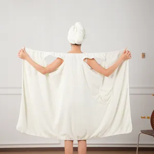 Close-up details of the soft waffle wearable bath towel featuring armholes and a handy pocket.