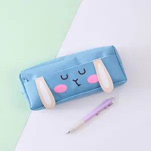 Close up of blue canvas pencil case featuring cute 3D bunny ears and a matching pen.