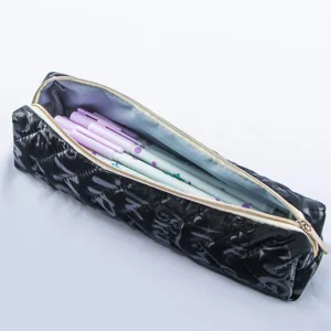 Black quilted pencil case with zipper for school stationery storage and daily use.