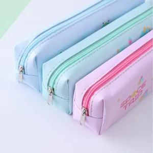 Detail view of cute pastel PU leather pencil cases with zipper and space print.