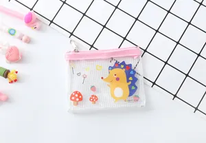 Close-up detail of clear PVC mesh pencil pouch with cute cartoon hedgehog and pink zipper.