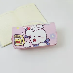 Cute pink rabbit pencil case detail showing double zipper and lovely cartoon pattern.
