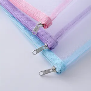 Close-up detail of pastel mesh zipper document bags, featuring durable transparent grid fabric.