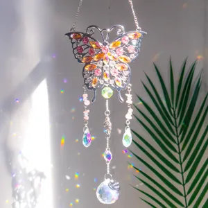 Detail of butterfly crystal suncatcher showing colorful gems and rainbow reflections.