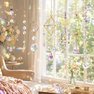 Close-up of sparkling K9 crystal suncatchers with gold butterfly and moon charms