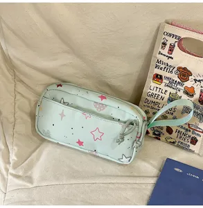 Cute light green pencil pouch with pink star print, portable canvas stationery storage bag.