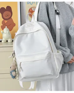 Sac à dos d'étudiant blanc minimaliste à grande capacité avec détails de breloque ours