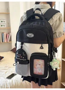 Detail view of school backpack clear window anime pouch color block student book bag design.