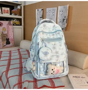 Zaino scolastico azzurro con motivi a stelle, tasca trasparente e grazioso orso di peluche