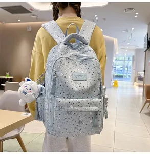 Stylish star print student backpack with large capacity and multi-compartment design for daily use.
