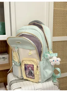 Color-block student backpack with clear pocket, large capacity school bag for teens.