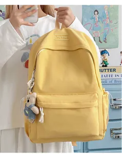 Vue détaillée du sac à dos jaune de grande capacité de couleur bonbon pour étudiants